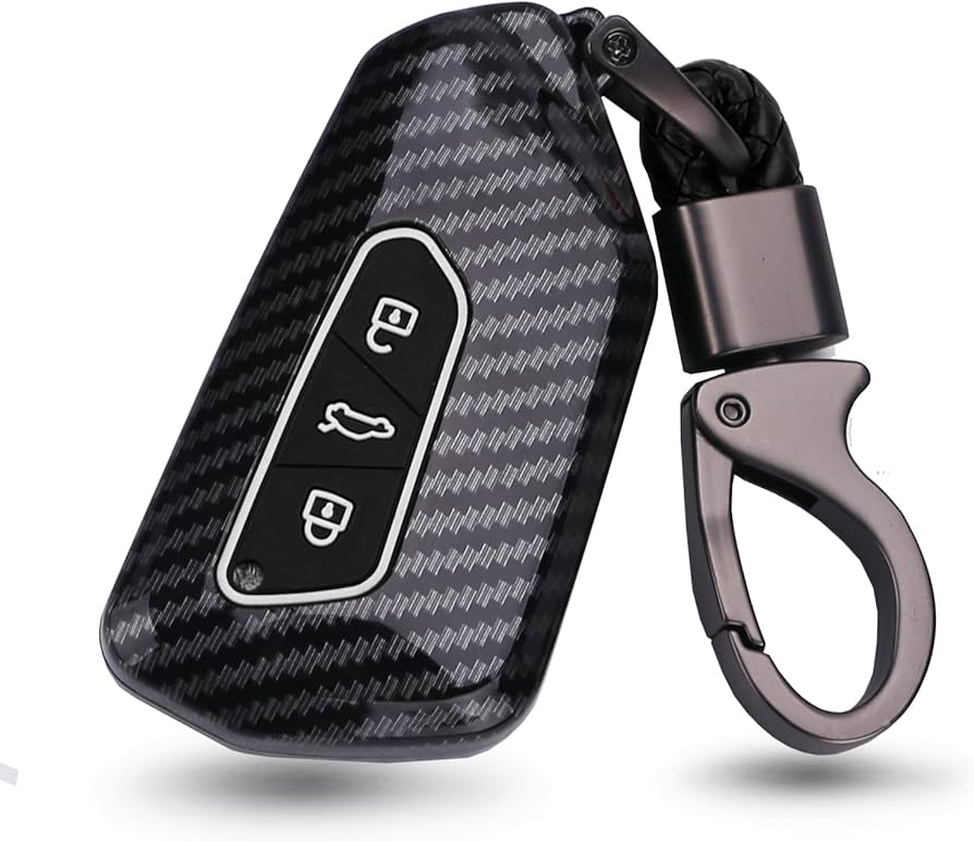 Car key cover with carbon fibre design, including a key fob and a keychain.